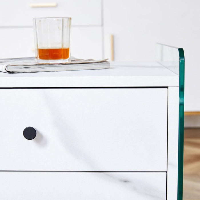 Double-drawer bedside table. The board surface is MDF sticker, and both sides are transparent tempered glass. The design is simple and elegant, with excellent storage functions.