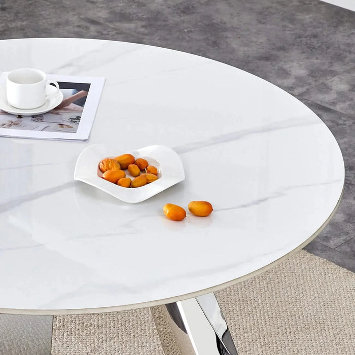 A 42-inch stainless steel leg round table with a marble top is suitable for use by four or six people Default -DTYStore