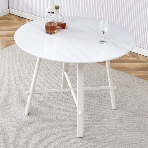 A modern minimalist circular dining table with a 42 inch diameter white patterned tabletop and white metal legs. Suitable for restaurants, living rooms, and conference rooms. Default -DTYStore