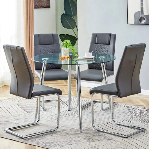 Table and chair set.A 38.6' Diameter Transparent Tempered Glass Round Dining Table-Silver Metal Legs.Paried With 4 Dark Gray High-quality PU Chairs With Silver Arched Metal Legs. Default -DTYStore