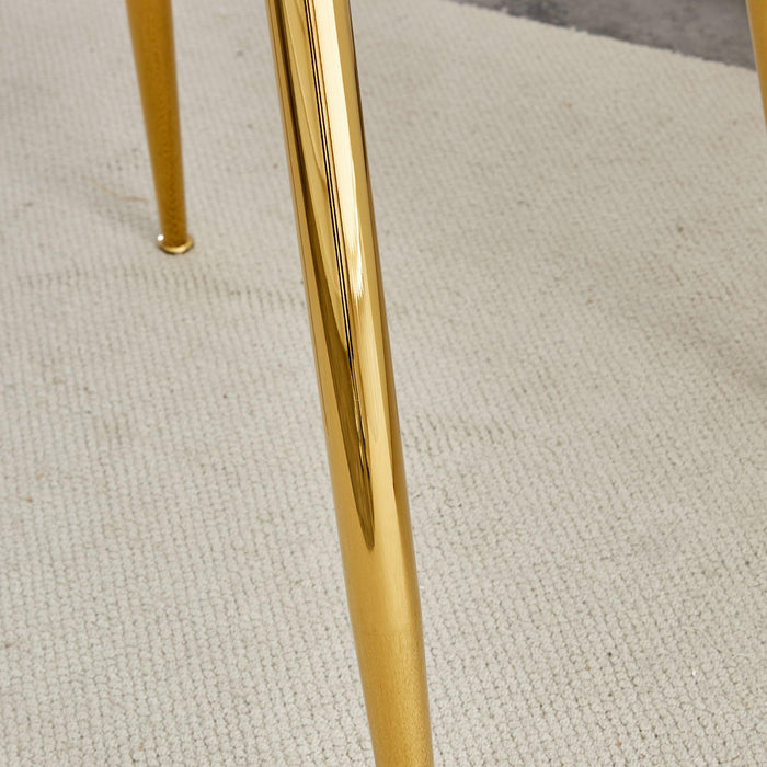 A glass tabletop with a diameter of 40 inches and a modern minimalist circular dining table with gold plated metal legs. 40 '* 40' * 30 ' DT-1164